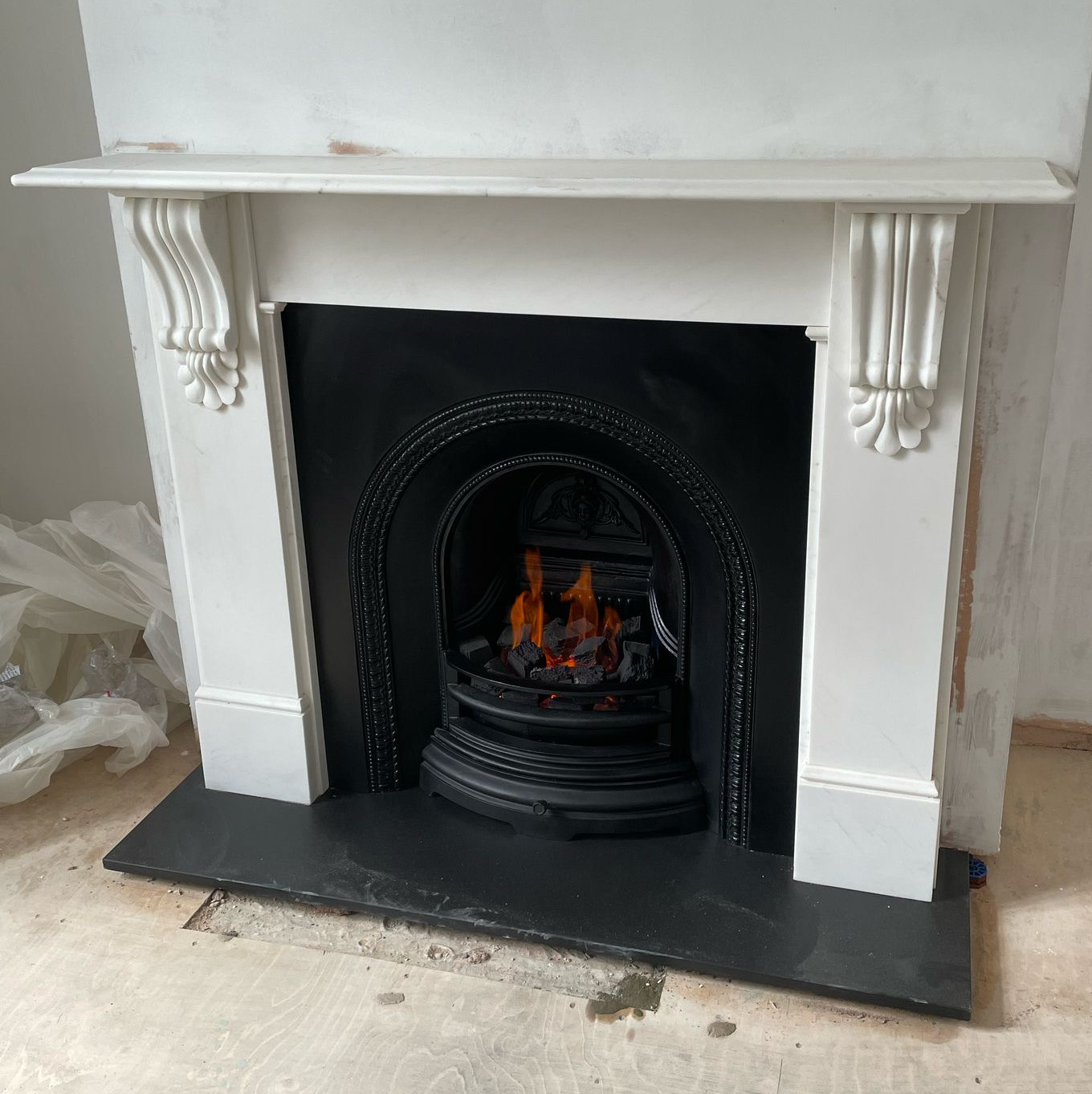 White marble "Corbel" mantel, "Better Hearth Arch" insert, gas fire